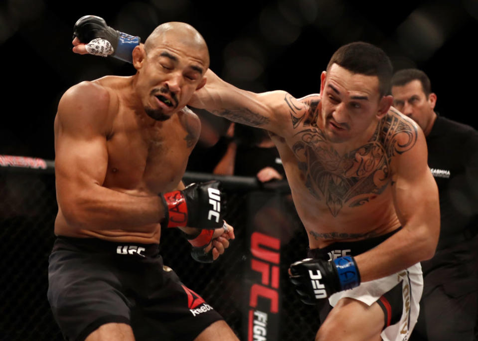 Max Holloway, right, defeated Jose Aldo by TKO at UFC 212. (Getty)