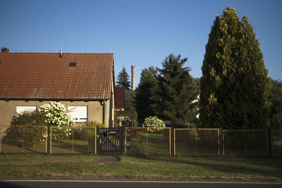 A cell tower stands between trees near the village Sternbeck in a rural region east of Berlin, Germany, Wednesday, Aug. 12, 2020. With the next generation of mobile technology, known as 5G, people in rural areas hope for a better internet connection than with the current 4G system. (AP Photo/Markus Schreiber)