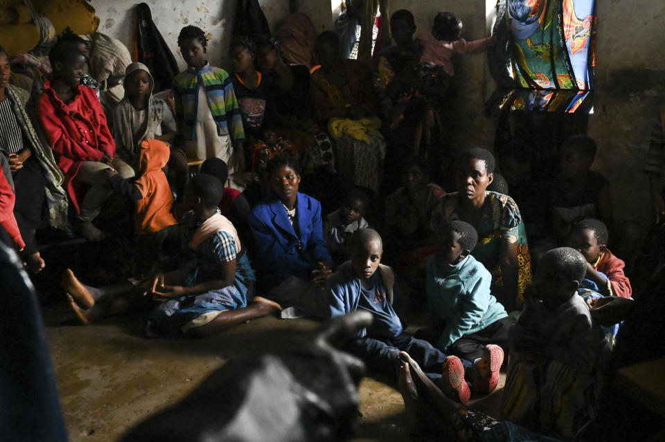 Mothers and their children at a displacement center in Blantyre, Malawi Tuesday March 14, 2023. The unrelenting Cyclone Freddy that is currently battering southern Africa has killed more than 50 people in Malawi and Mozambique since it struck the continent for a second time on Saturday night. (AP Photo/Thoko Chikondi)