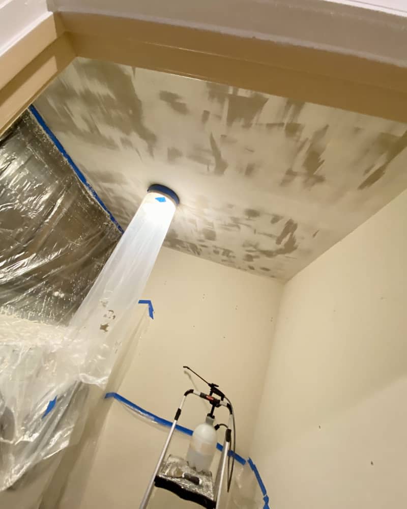 Ceiling in process of treatment with plastic covering machines and light