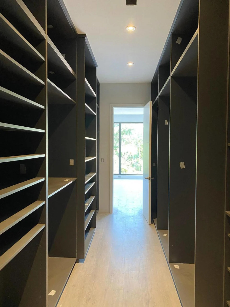 A walk-in closet at one of the 12 luxury townhouses on Coconut Avenue in Coconut Grove that developer Doug Cox of Drive Development built. The photo was taken in 2021 by a buyer.