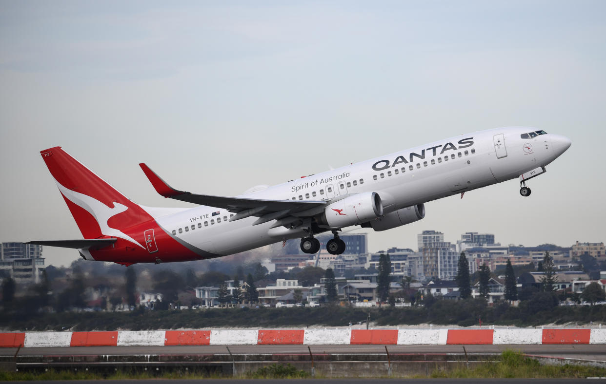 SYDNEY, AUSTRALIA - NOVEMBER 16: A Qantas Boeing 737-800 aircraft takes off at Sydney's Kingsford Smith Airport on November 16, 2020 in Sydney, Australia. Australia's national airline Qantas is celebrating 100 years of operation today having been founded in Winton, Queensland on 16th November 1920 named as Queensland and Northern Territory Aerial Services Limited by Paul McGinness and Hudson Fysh. (Photo by James D. Morgan/Getty Images)