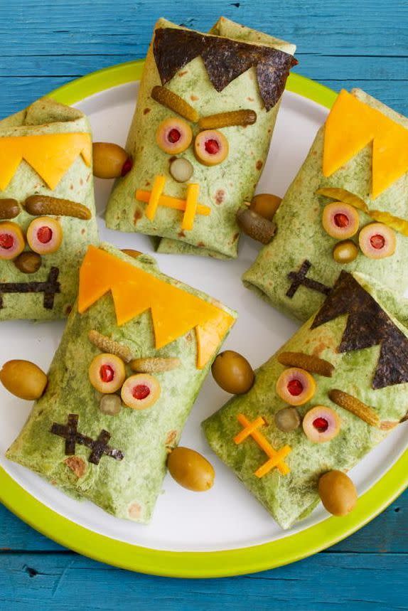 <p>Make app-sized sandwiches come to life with sliced Cheddar, olives and cornichon pickles that form a monstrous face!</p><p>Get the <strong><a href="https://www.womansday.com/food-recipes/a33564111/monster-wraps-recipe/" rel="nofollow noopener" target="_blank" data-ylk="slk:Monster Wraps recipe;elm:context_link;itc:0;sec:content-canvas" class="link ">Monster Wraps recipe</a> </strong>from Woman's Day. </p><p><strong>RELATED: </strong><a href="https://www.goodhousekeeping.com/holidays/halloween-ideas/g565/halloween-party-ideas/" rel="nofollow noopener" target="_blank" data-ylk="slk:Scary-Good Halloween Party Ideas to Guarantee a Good Time;elm:context_link;itc:0;sec:content-canvas" class="link ">Scary-Good Halloween Party Ideas to Guarantee a Good Time</a></p>