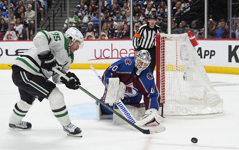 Dallas Stars center Matt Duchene, left, has his shot blocked by Colorado Avalanche goaltender Alexandar Georgiev during the first overtime of Game 6 of an NHL hockey playoff series Friday, May 17, 2024, in Denver. (AP Photo/David Zalubowski)