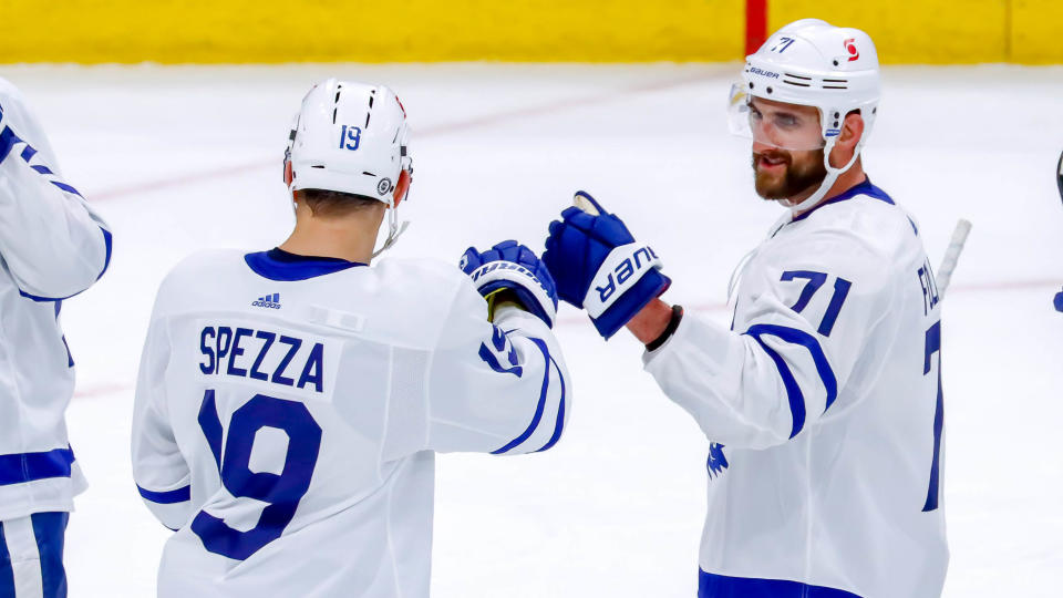 WINNIPEG, MB - APRIL 22: Jason Spezza #19 and Nick Foligno #71 of the Toronto Maple Leafs celebrate a 5-3 victory over the Winnipeg Jets at the Bell MTS Place on April 22, 2021 in Winnipeg, Manitoba, Canada. (Photo by Darcy Finley/NHLI via Getty Images)