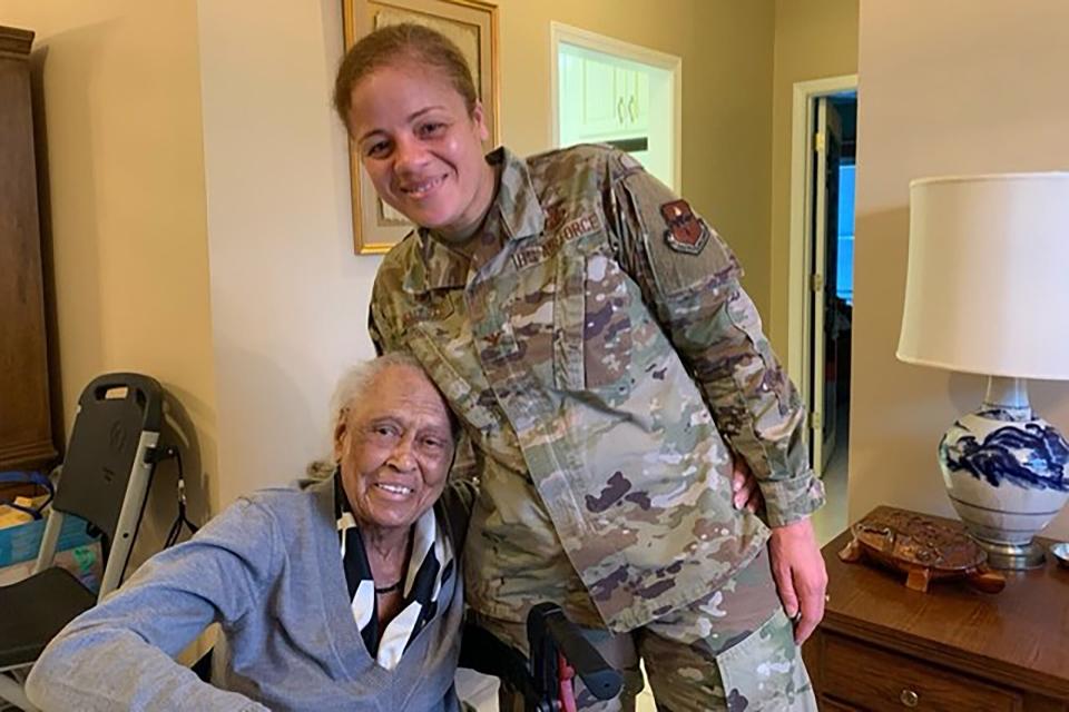 102-year-old WWII vet Romay Davis receiving Congressional Medal of Honor Davis with Col. Eries L.G. Mentzer.