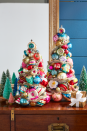 <p>Create ornament covered trees using either vintage or new ornaments. Add garland or lights for a little extra sparkle. The best part is, you can save these trees for many years to come! </p>