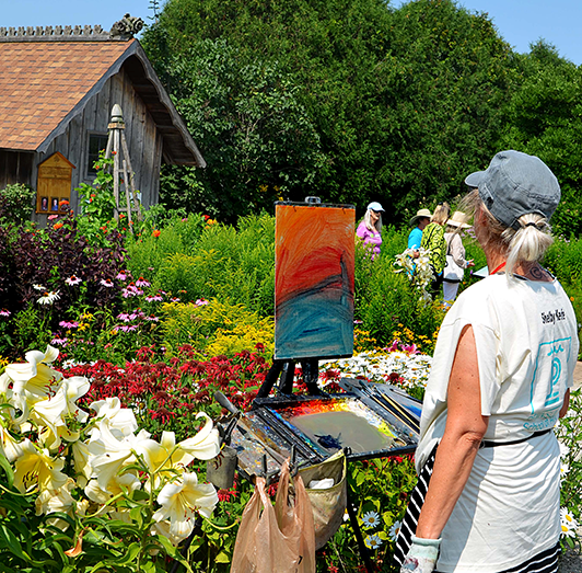 Nationally renowned artist Shelby Keefe of Milwaukee paints a scene at Woodwalk Gallery in Egg Harbor during the 2022 Door County Plein Air Festival. Keefe is one of 33 artists who will be in various locations around the Peninsula to paint what they see in front of them during the 2023 festival, which runs from July 23 to 29.