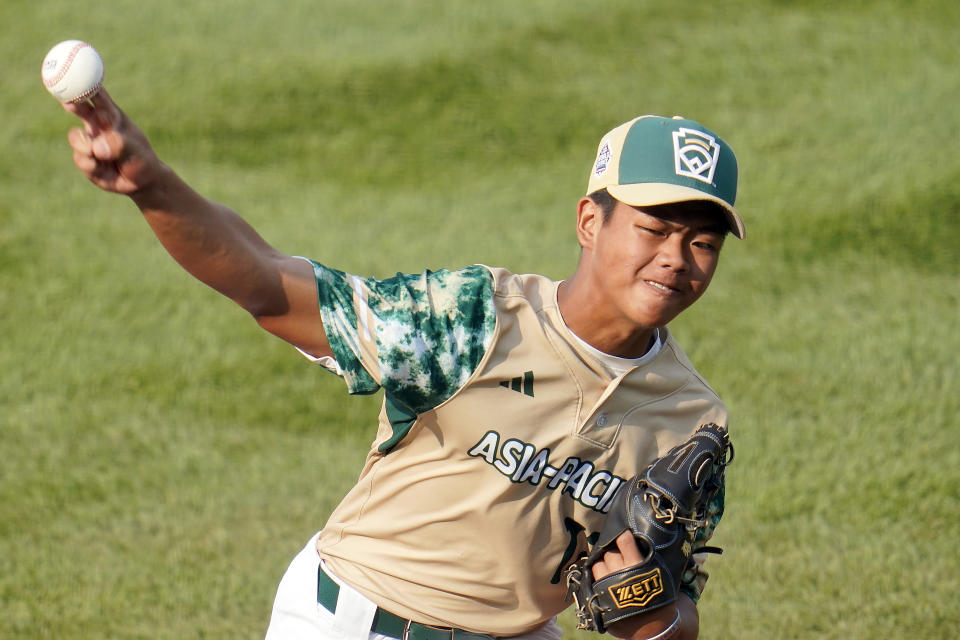 Taiwan starting pitcher Fan Chen-Jun delivers against Japan during the first inning of a baseball game at the Little League World Series tournament in South Williamsport, Pa., Monday, Aug. 21, 2023. (AP Photo/Tom E. Puskar)