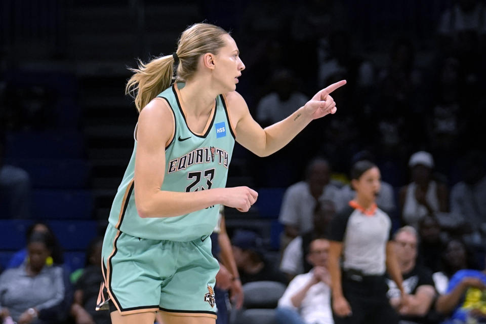 New York Liberty guard Marine Johannes celebrates sinking a 3-point basket during the first half of the team's WNBA basketball game against the Dalls Wings in Arlington, Texas, Wednesday, Aug. 10, 2022. (AP Photo/Tony Gutierrez)