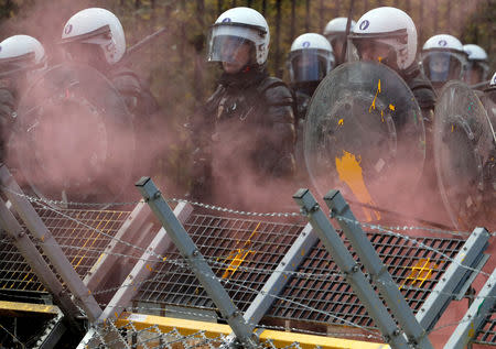 Riot police are seen during the "yellow vests" protest against higher fuel prices, in Brussels, Belgium, December 8, 2018. REUTERS/Yves Herman