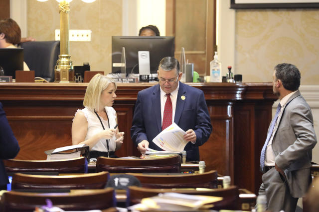 South Carolina Rep. John McCravy, R-Greenwood, reviews a list of amendments before the House begins debating an abortion bill on Tuesday, May 16, 2023, in Columbia, South Carolina. (AP Photo/Jeffrey Collins)