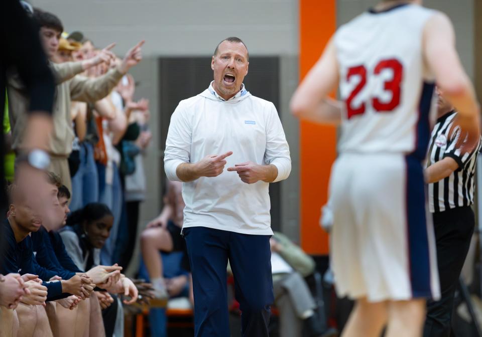 Britton Deerfield head coach Darren Shiels calls out from the bench during the Division 4 regional semifinal against Allen Park Inter-City Baptist at Summerfield.