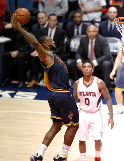 ATLANTA, GA - MAY 20: Forward LeBron James #23 of the Cleveland Cavaliers dunks to seal the game while guard Jeff Teague #0 of the Atlanta Hawks looks on during Game One of the Eastern Conference Finals during the NBA Playoffs at Philips Arena on May 20, 2015 in Atlanta, Georgia. NOTE TO USER: User expressly acknowledges and agrees that, by downloading and or using this photograph, User is consenting to the terms and conditions of the Getty Images License Agreement. (Photo by Mike Zarrilli/Getty Images)