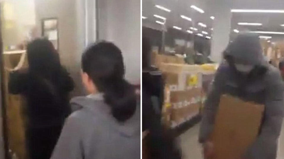Customers attempt to shield their face as they rush the unpacked boxes of formula to the checkout. Images: 7 News