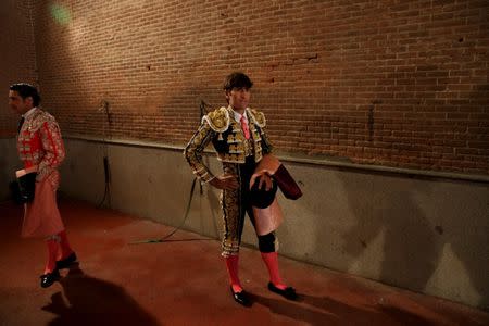 Alberto Lamelas (R) stands inside Las Ventas bullring beside bullfighter assistance Fernando Tellez just minutes before taking part in a bullfighting during the San Isidro festival in Madrid, Spain, June 5, 2017. REUTERS/Sergio Perez