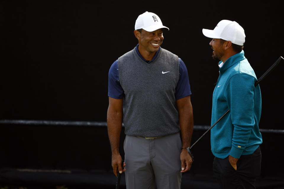 Tiger Woods (pictured left) having a chat with Jason Day (pictured right).