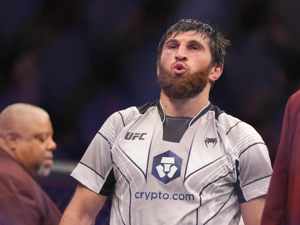 Dec 10, 2022; Las Vegas, Nevada, USA; Magomed Ankalaev (blue gloves) reacts after the fight against Jan Blachowicz (red gloves) during UFC 282 at T-Mobile Arena. Mandatory Credit: Stephen R. Sylvanie-USA TODAY Sports