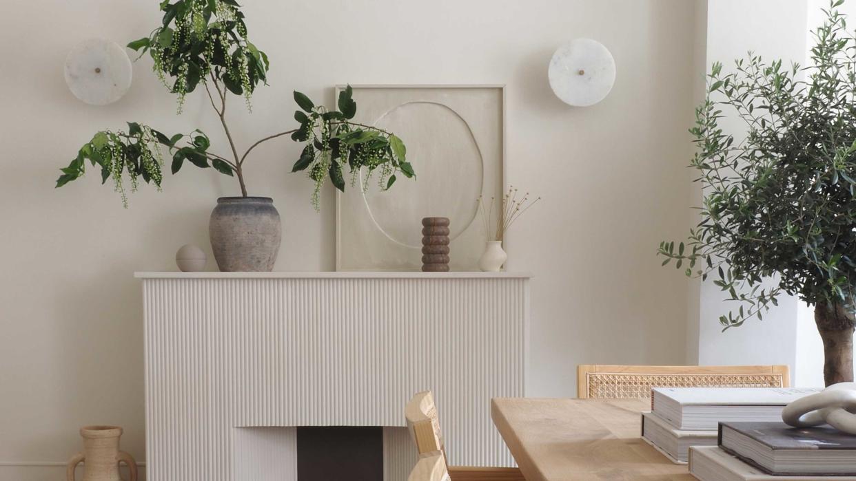  a ridged fireplace with a dining table in front 