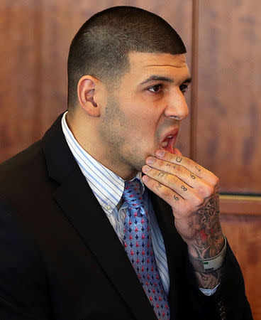 FILE PHOTO - Aaron Hernandez appears for a pre-trial hearing at Bristol County Superior Court in Fall River, Massachusetts, U.S. on February 7, 2014. REUTERS/Jonathan Wiggs/Boston Globe/Pool/File Photo