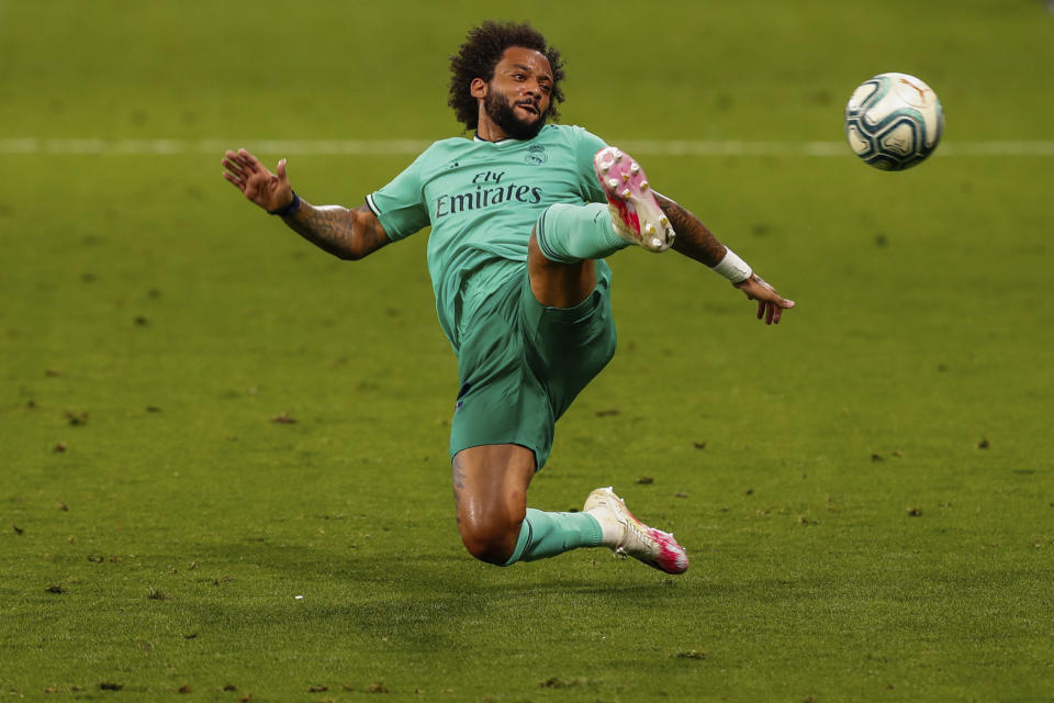 Real Madrid's Marcelo in action during the Spanish La Liga soccer match between RCD Espanyol and Real Madrid at the Cornella-El Prat stadium in Barcelona, Spain, Sunday, June 28, 2020. (AP Photo/Joan Monfort)