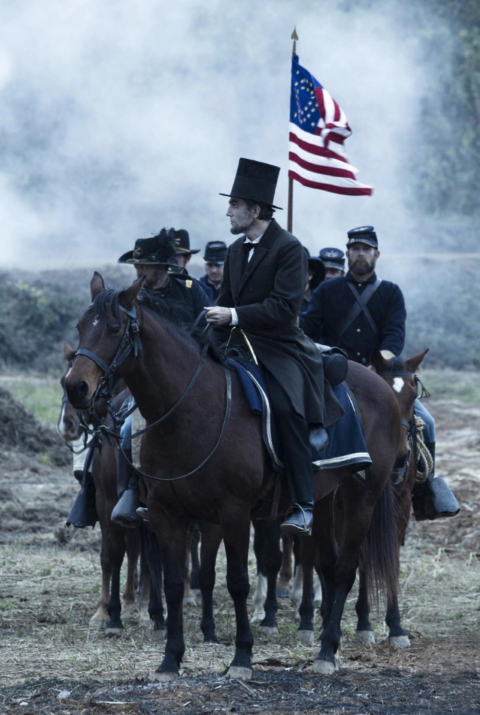 This undated publicity photo provided by DreamWorks and Twentieth Century Fox shows Daniel Day-Lewis as President Abraham Lincoln looking across a battlefield in the aftermath of a terrible siege in this scene from director Steven Spielberg's drama "Lincoln" from DreamWorks Pictures and Twentieth Century Fox. “Lincoln” star Daniel Day-Lewis is expected to earn his third Oscar in the title role, making him only the sixth performer to win three or more Oscars and the first to win three times in the best-actor category. (AP Photo/DreamWorks, Twentieth Century Fox, David James, File)