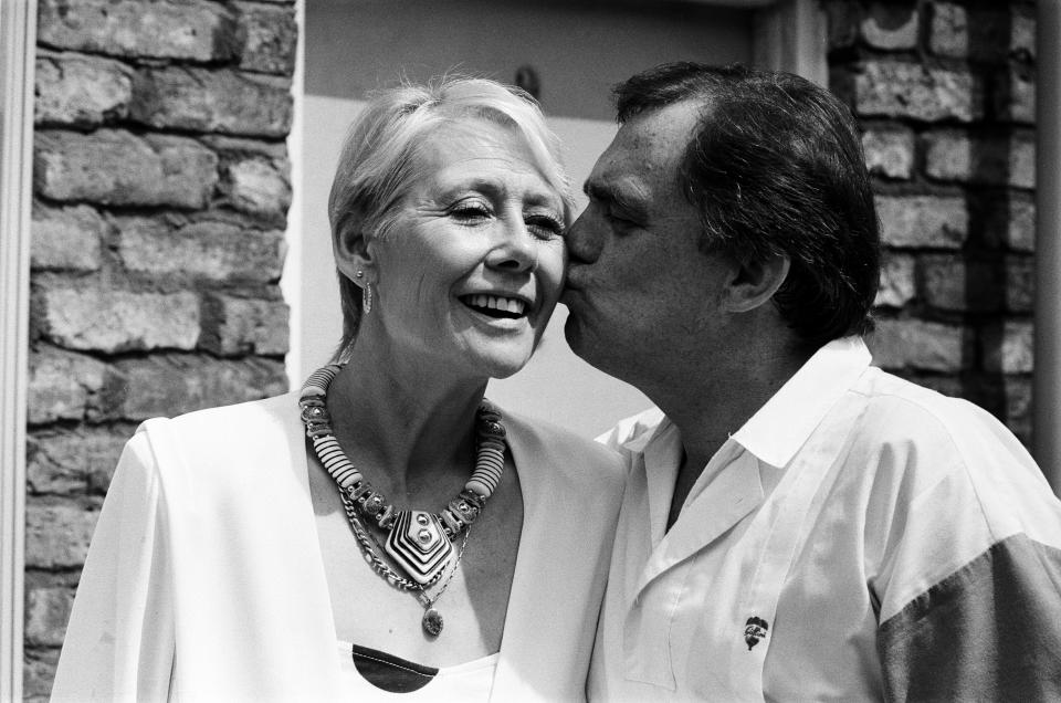 Actor Bill Tarmey (Jack Duckworth) is welcomed back to Granada TV's 'Coronation Street' by his ever loving screen wife Liz Dawn (Vera Duckworth). Bill has been absent from the soap for some months having undergone major heart surgery, 6th July 1987. (Photo by Chris Paterson/Daily Mirror Manchester/Mirrorpix/Getty Images)