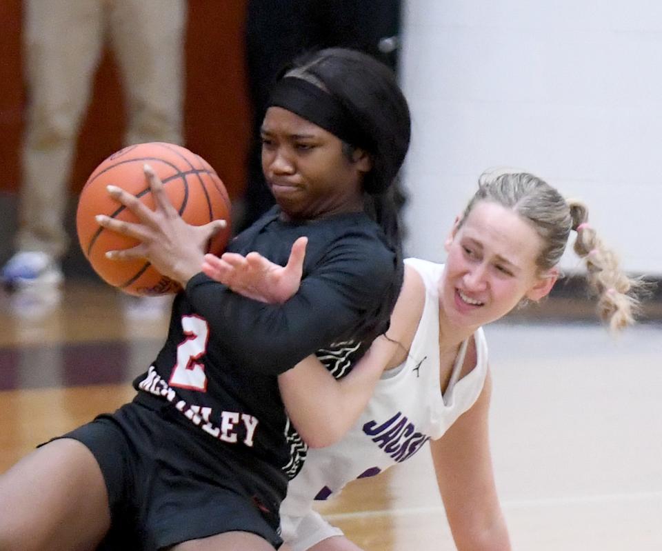 McKinley's Paris Stokes comes away with a loose ball after a scramble in the first half of a Jan. 7 game at Jackson.