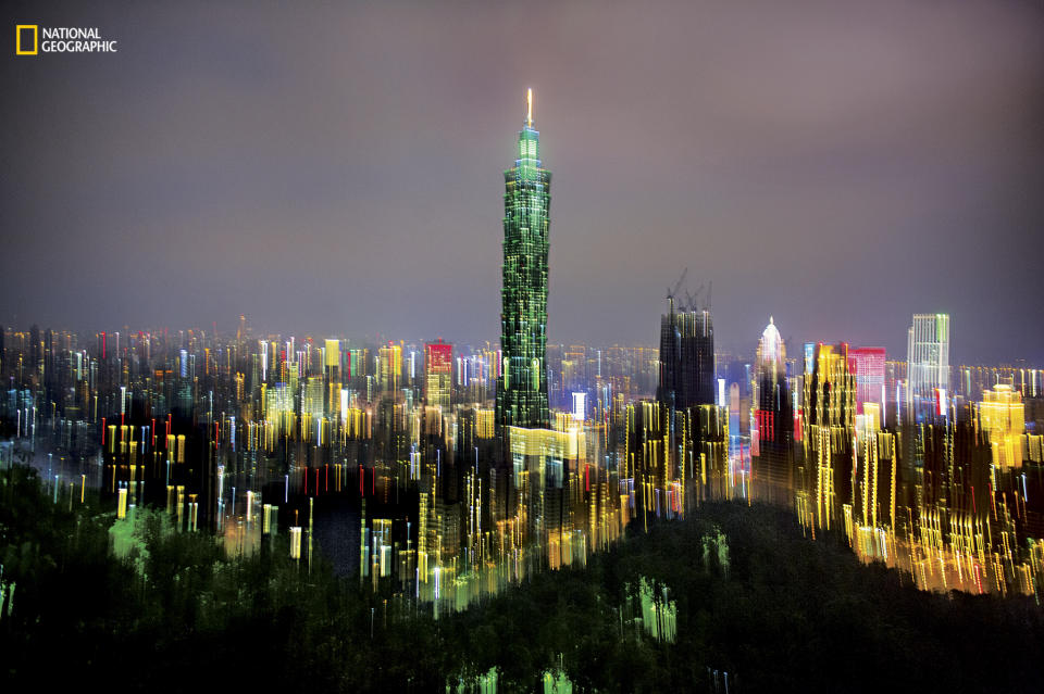 <p>The city lights of Taipei burn in multicolour after dark. (Dina Litovsky/National Geographic) </p>