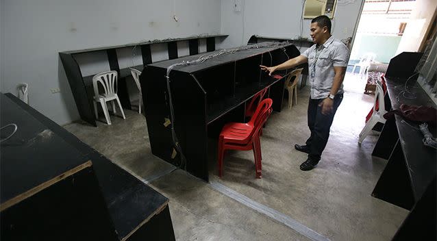 Thomas Vincent Martinez, son of the president of Mountaintop Christian Academy, shows the area being used as an alleged internet porn operation beside their school. Photo: AP.