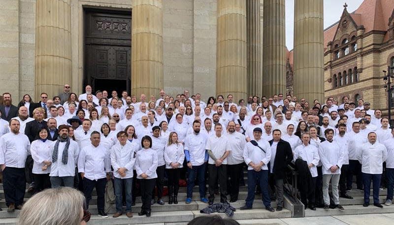 After the service for Jean-Robert de Cavel, chefs posed for a photo outside The Cathedral Basilica of Saint Peter in Chains in downtown Cincinnati, Monday, Jan. 16, 2023. The well-known chef, 61, died Dec. 23, 2022 after a long battle with cancer. 