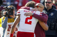 Minnesota head coach P.J. Fleck, right, hugs and speaks to Nebraska quarterback Adrian Martinez (2) after an NCAA college football game Saturday, Oct. 16, 2021, in Minneapolis. Minnesota won 30-23. (AP Photo/Bruce Kluckhohn)