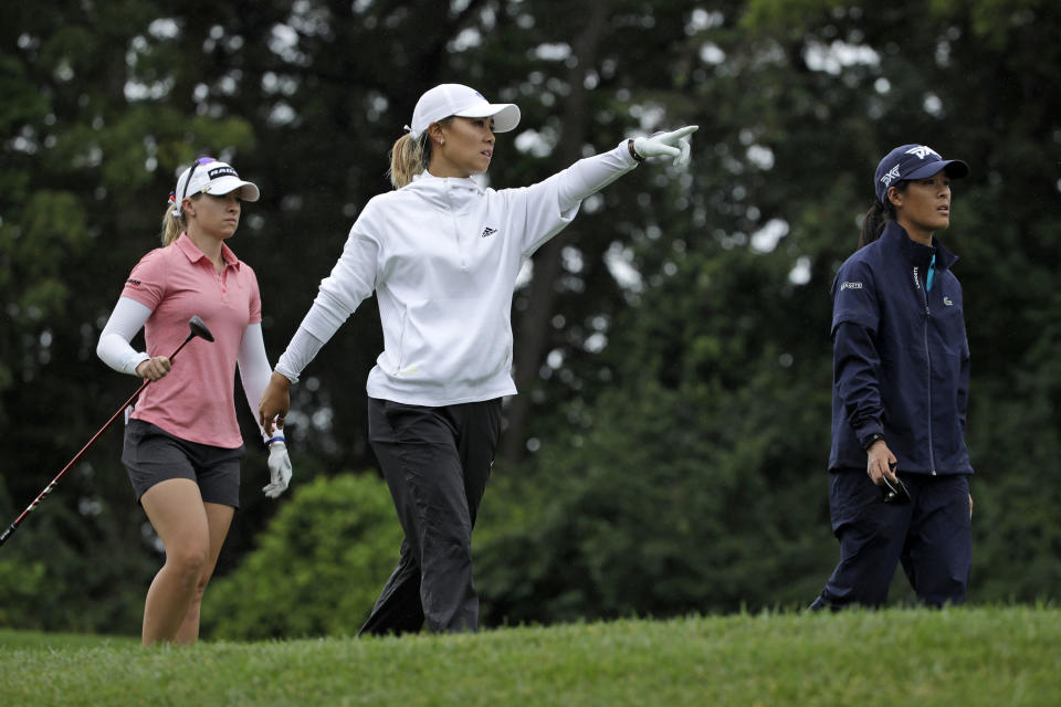 Danielle Kang, center, Celine Boutier, right, of France, and Jodi Ewart Shadoff, of England, walk off the fourth tee box after hitting their drives during the third and final round of the LPGA Drive On Championship golf tournament Sunday, Aug. 2, 2020, at Inverness Golf Club in Toledo, Ohio. (AP Photo/Gene J. Puskar)