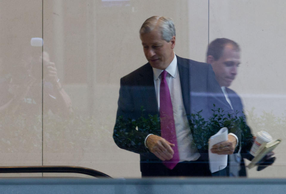 JPMorgan Chase CEO Jamie Dimon enter the company's headquarters in New York Friday, July 13, 2012. JPMorgan Chase, the largest bank in the United States, said Friday that its loss from a highly publicized trading blunder had grown to $4.4 billion in the most recent quarter, more than double the bank's original estimate of $2 billion. (AP Photo/Jin Lee)