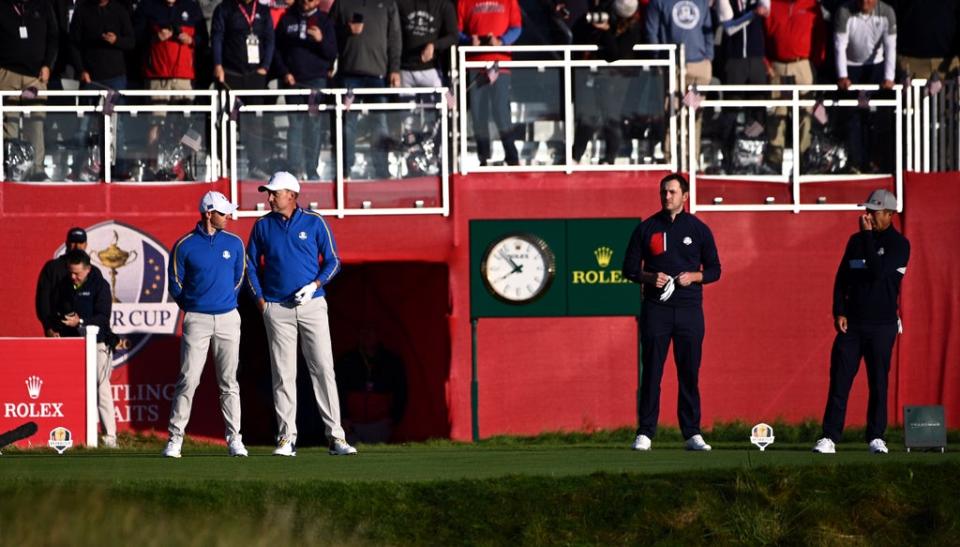 Rory McIlroy and Ian Poulter line up ahead of their foursomes match against Xander Schauffele and Patrick Cantlay on day one of the 43rd Ryder Cup (Anthony Behar/PA) (PA Wire)