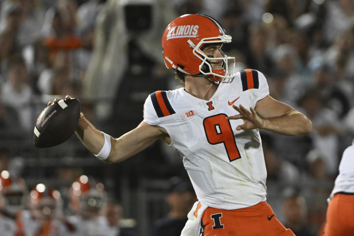 Illinois quarterback Luke Altmyer (9) throws a pass against Penn State during the first half of an NCAA college football game, Saturday, Sept. 28, 2024, in State College, Pa. (AP Photo/Barry Reeger)