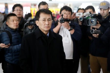 North Korean diplomat Choe Kang Il (C) waits at Capital International Airport to check in to a flight to Helsinki in Beijing, China March 18, 2018.  REUTERS/Thomas Peter