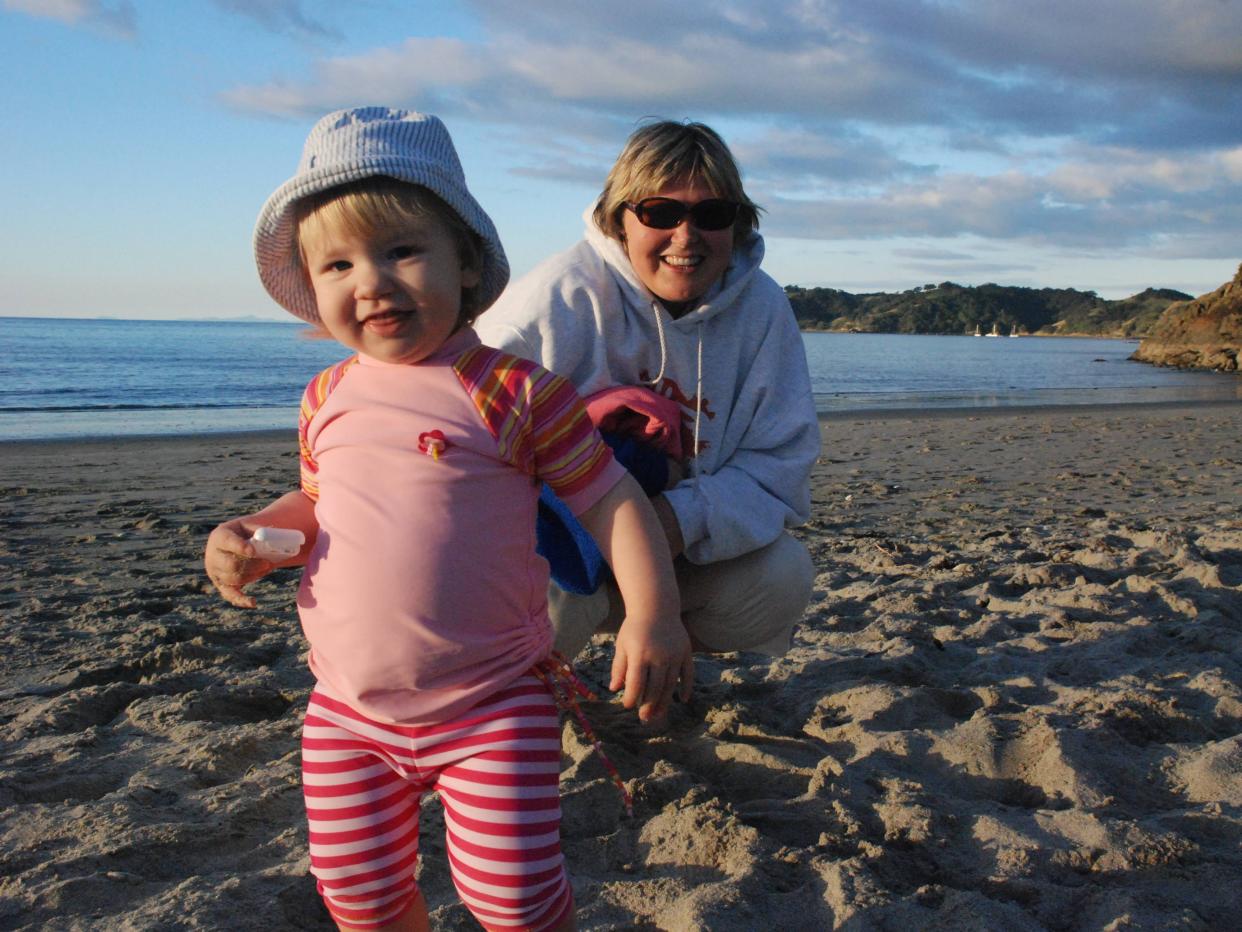 Mom with toddler at beach in New Zealand