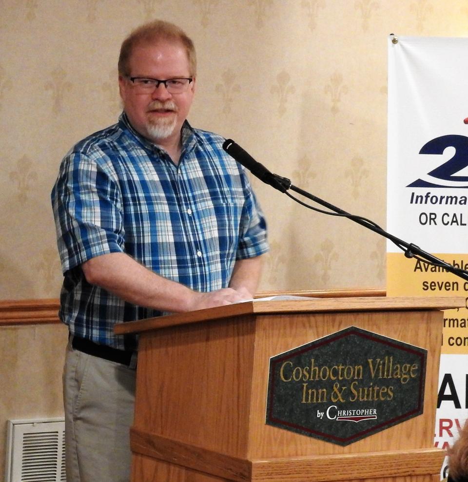 Tom Heading speaking at a past United Way breakfast.