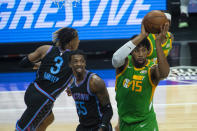 Utah Jazz center Derrick Favors (15) pulls down a rebound against the Sacramento Kings during the first quarter of an NBA basketball game in Sacramento, Calif., Sunday, May 16, 2021. (AP Photo/Randall Benton)