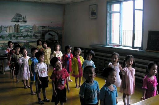 File photo shows North Korean children standing in line at a government-run kindergarten. South Korea said Thursday it would allow a private group to send aid to North Korea, the first such approval since the North's deadly bombardment of a border island last November