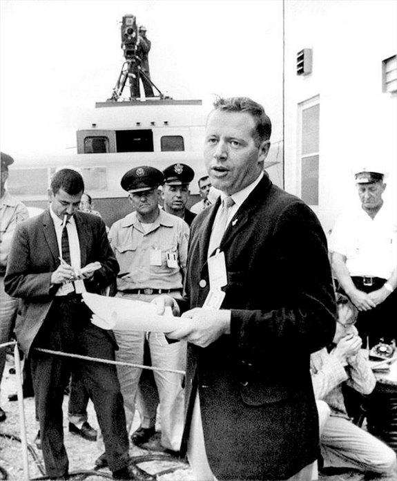 Jack King, the first chief of Public Information for NASA's Launch Operations Center at Cape Canaveral Air Force Station, briefs the news media on the May 2, 1961 postponement of the launch of Mercury Redstone-3 due to unfavorable weather. Thre