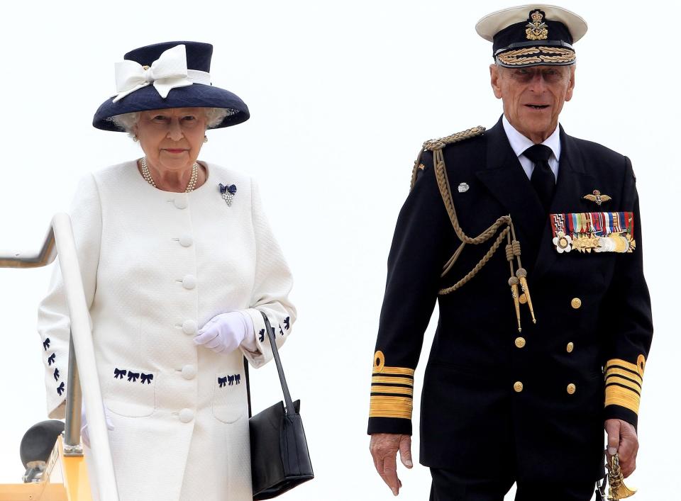 Queen Elizabeth II and the Duke of Edinburgh leave HMCS St John's after a Naval review to mark the 100th anniversary of the Canadian Navy, in the waters off Halifax in Nova Scotia, Canada.PA