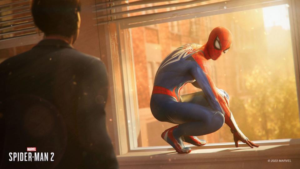 Spider-Man sits on a windowsill in Insomniac's "Spider-Man 2" video game.