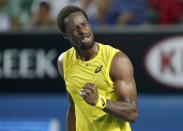 Gael Monfils of France celebrates a point during his men's singles match against Ryan Harrison of the United States at the Australian Open 2014 tennis tournament in Melbourne January 14, 2014. REUTERS/Bobby Yip