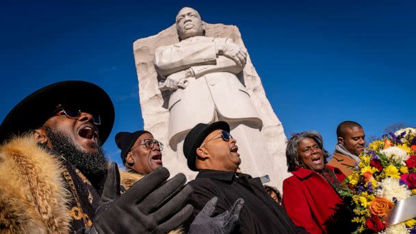 PHOTO: People sing during a wreath-laying ceremony at the Martin Luther King, Jr., Memorial on Martin Luther King Jr. Day in Washington, D.C., Jan. 16, 2023. (Andrew Harnik/AP)