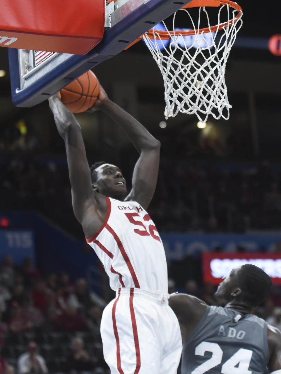 Oklahoma forward Kur Kuath (52) goes up for a shot over Mississippi State forward Abdul Ado (24) during the first half of an NCAA college basketball game in Oklahoma City, Saturday, Jan. 25, 2020. (AP Photo/Kyle Phillips)
