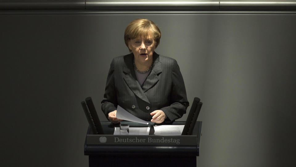 German Chancellor Angela Merkel delivers her speech, on the Ukrainian crisis at the parliament Bundestag in Berlin, Thursday, March 13, 2014, German Chancellor Angela Merkel warned Moscow on Thursday that if it continues its current course in the Ukraine crisis, Russia risks “massive” political and economic consequences. In an address to Parliament, Merkel told lawmakers the only way out of the crisis is through diplomacy and assured lawmakers that “the use of the military is no option.” (AP Photo/Markus Schreiber)