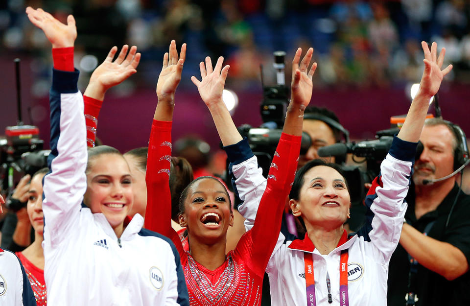 <p>McKayla Maroney, Gabby Douglas and Jenny Zhang of Team USA celebrate during the final rotation in the team final on July 31, 2012 in London. (Jamie Squire/Getty Images) </p>