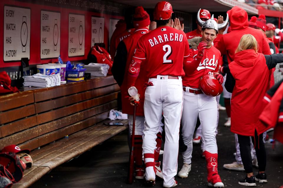 Cincinnati Reds shortstop Kevin Newman (28) is congratulated after hitting a two-run home run in the first inning of a baseball game between the Pittsburgh Pirates and the Cincinnati Reds, Saturday, April 1, 2023, at Great American Ball Park in Cincinnati. 